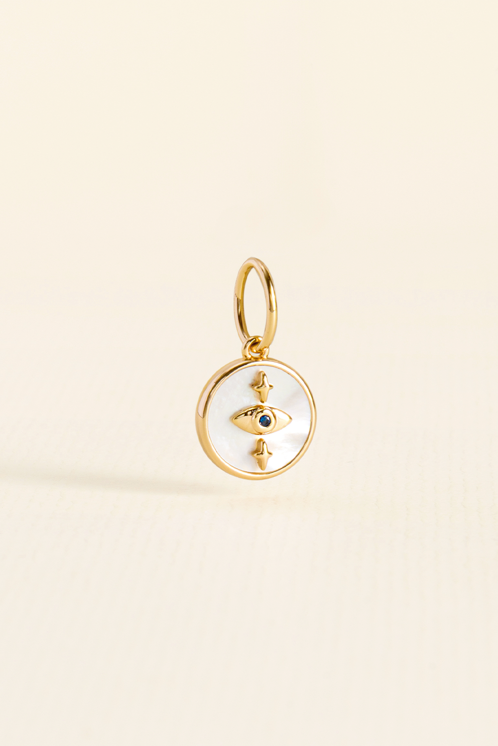 PINGENTE CHARM BAR OLHO MADREPEROLA DOURADO