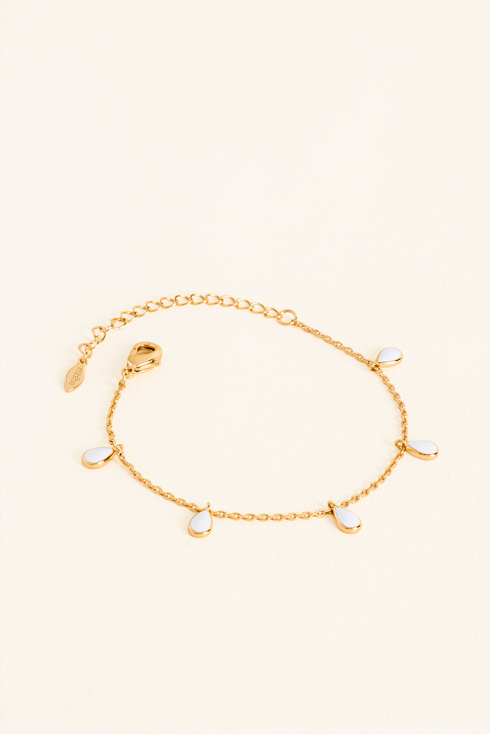 PULSEIRA TACHINHAS INTUIÇÃO BRANCA ESMALTADA DOURADO